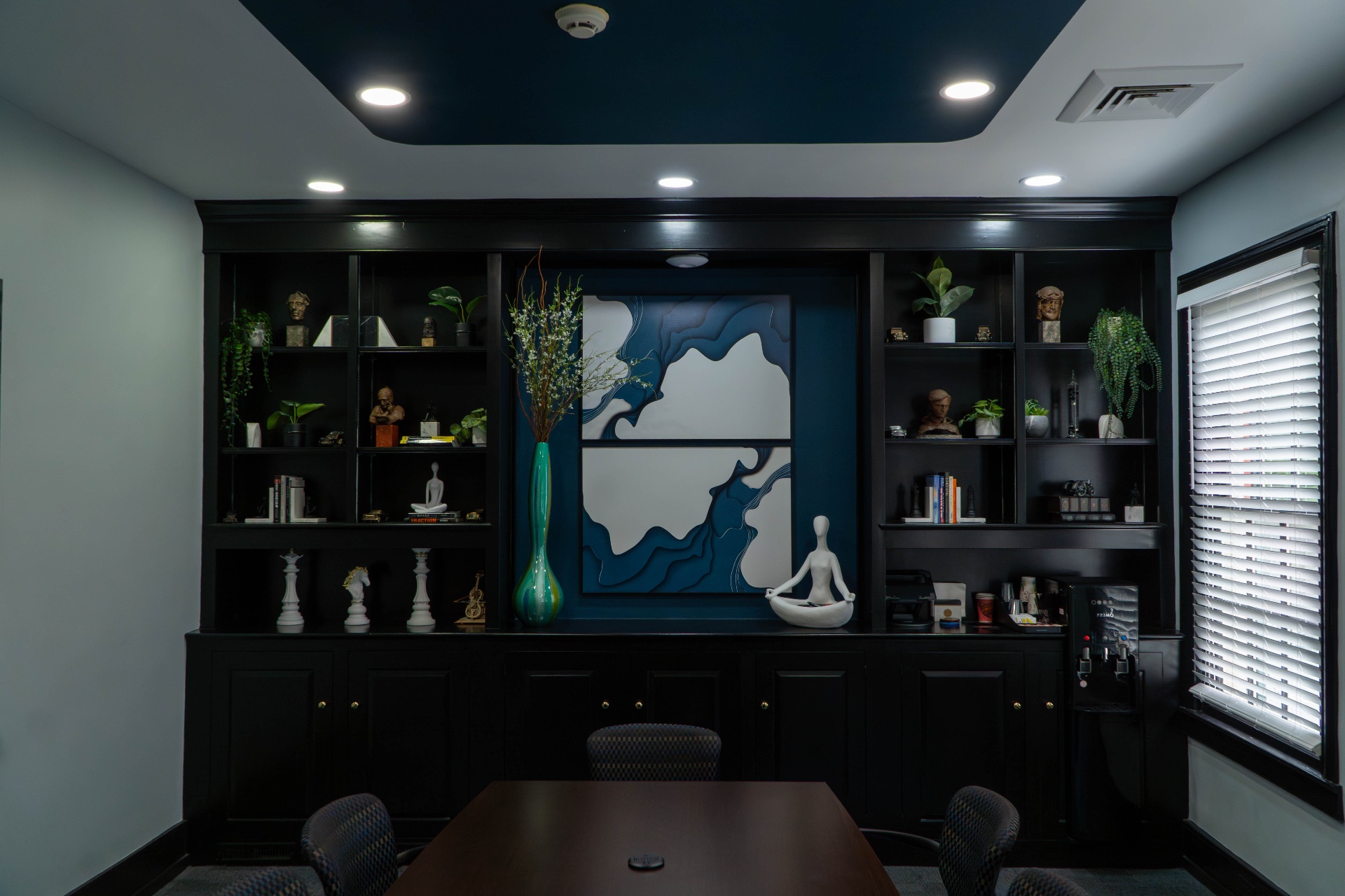 Tray ceiling and recessed lighting over conference table