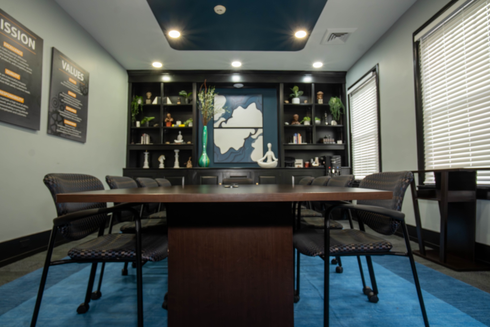 Conference room perspective with cobalt area rug