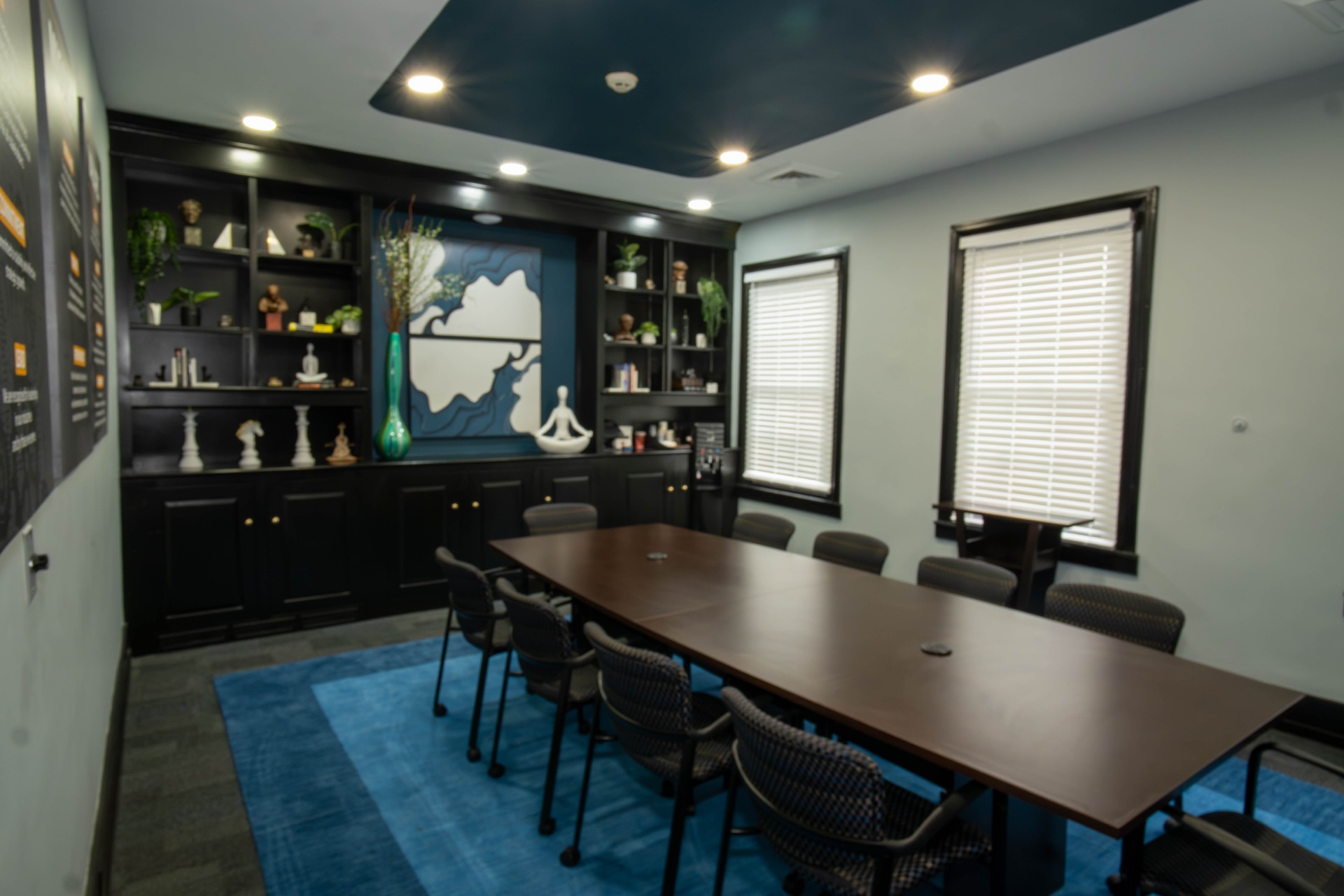 Wide view of the boardroom with windows and built-ins