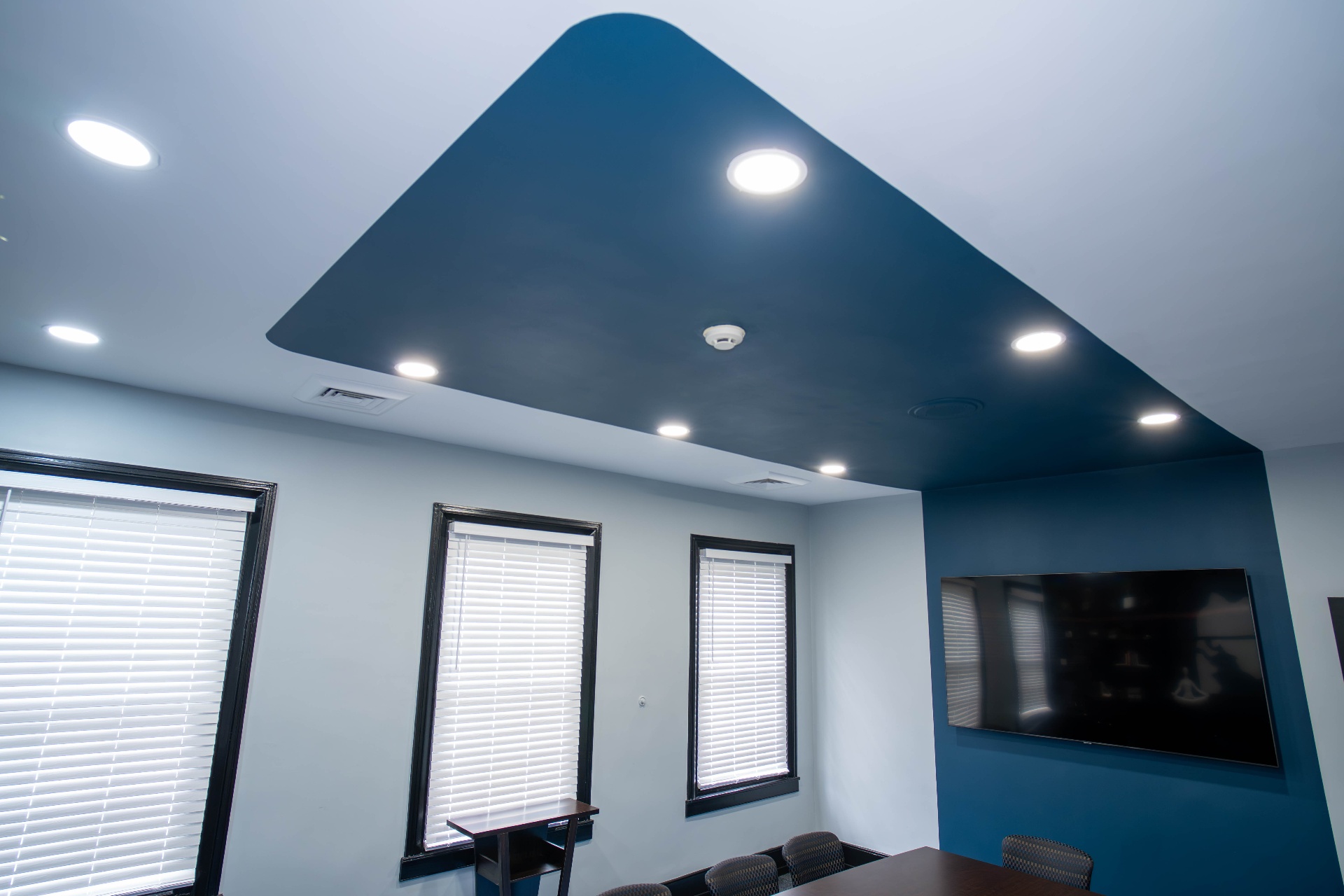 Detail of the painted tray ceiling against soft gray walls