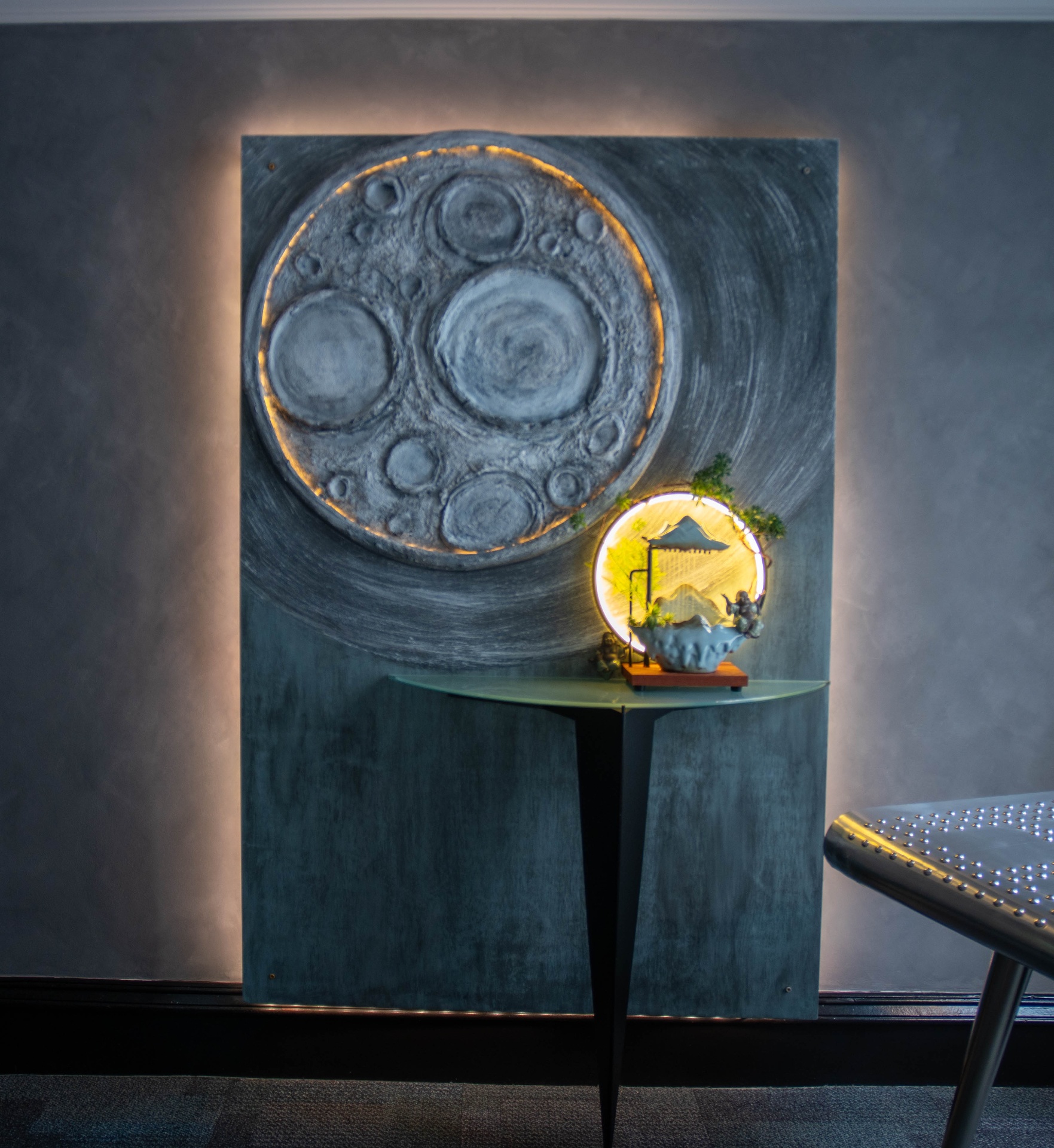 Close view of the illuminated moon and lantern sculpture