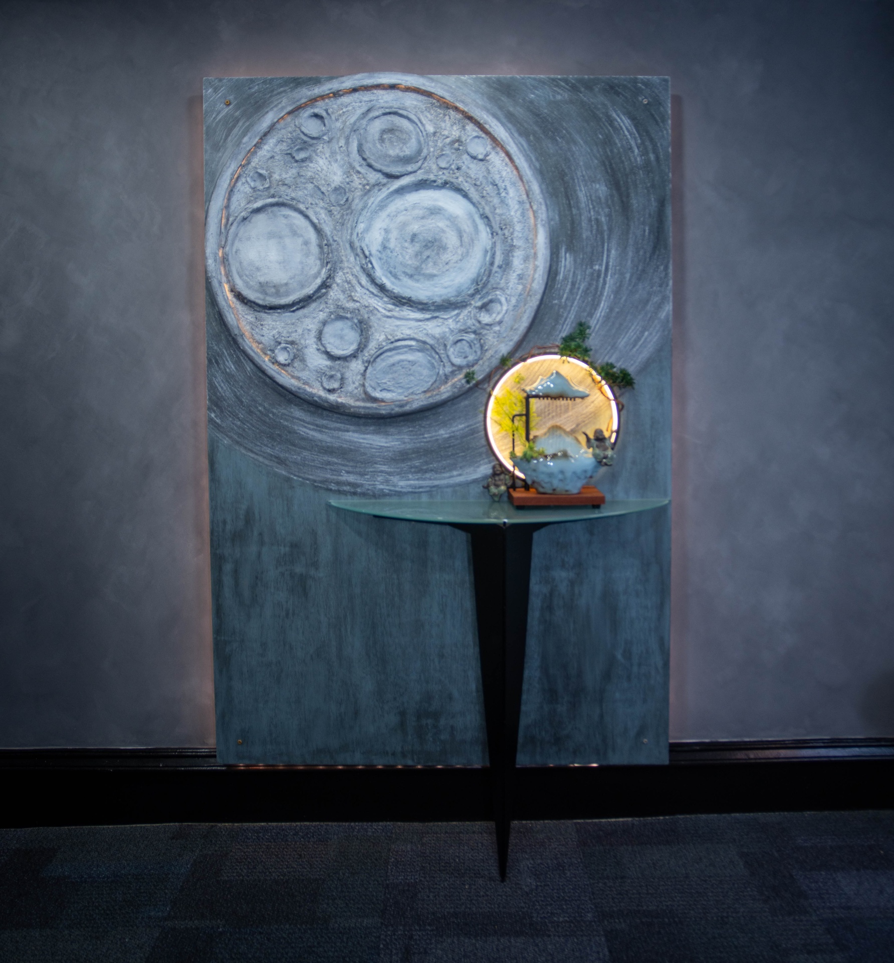 Detail of the lit pagoda diorama against the moon panel