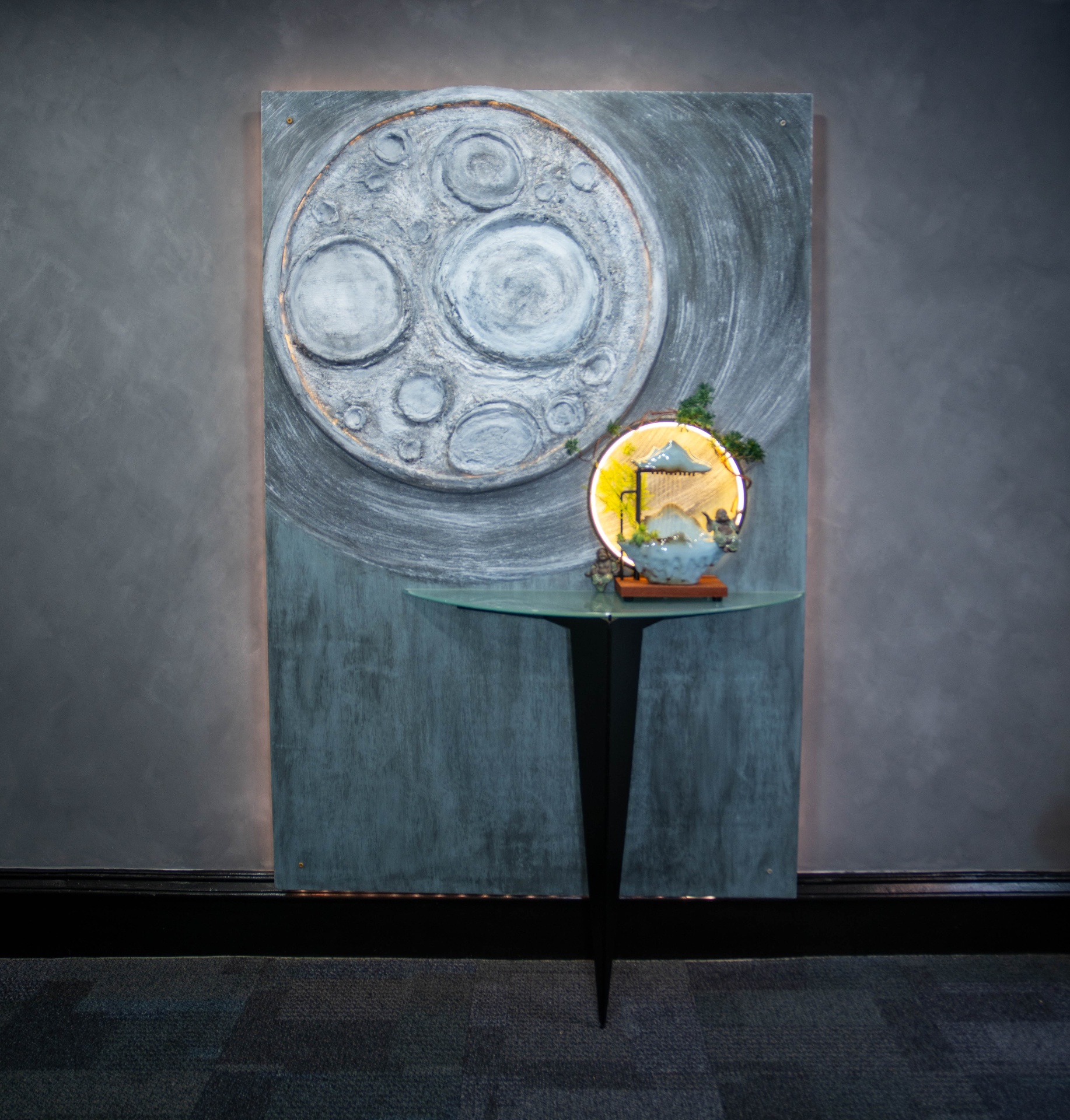 Close detail of the textured moon panel with backlighting