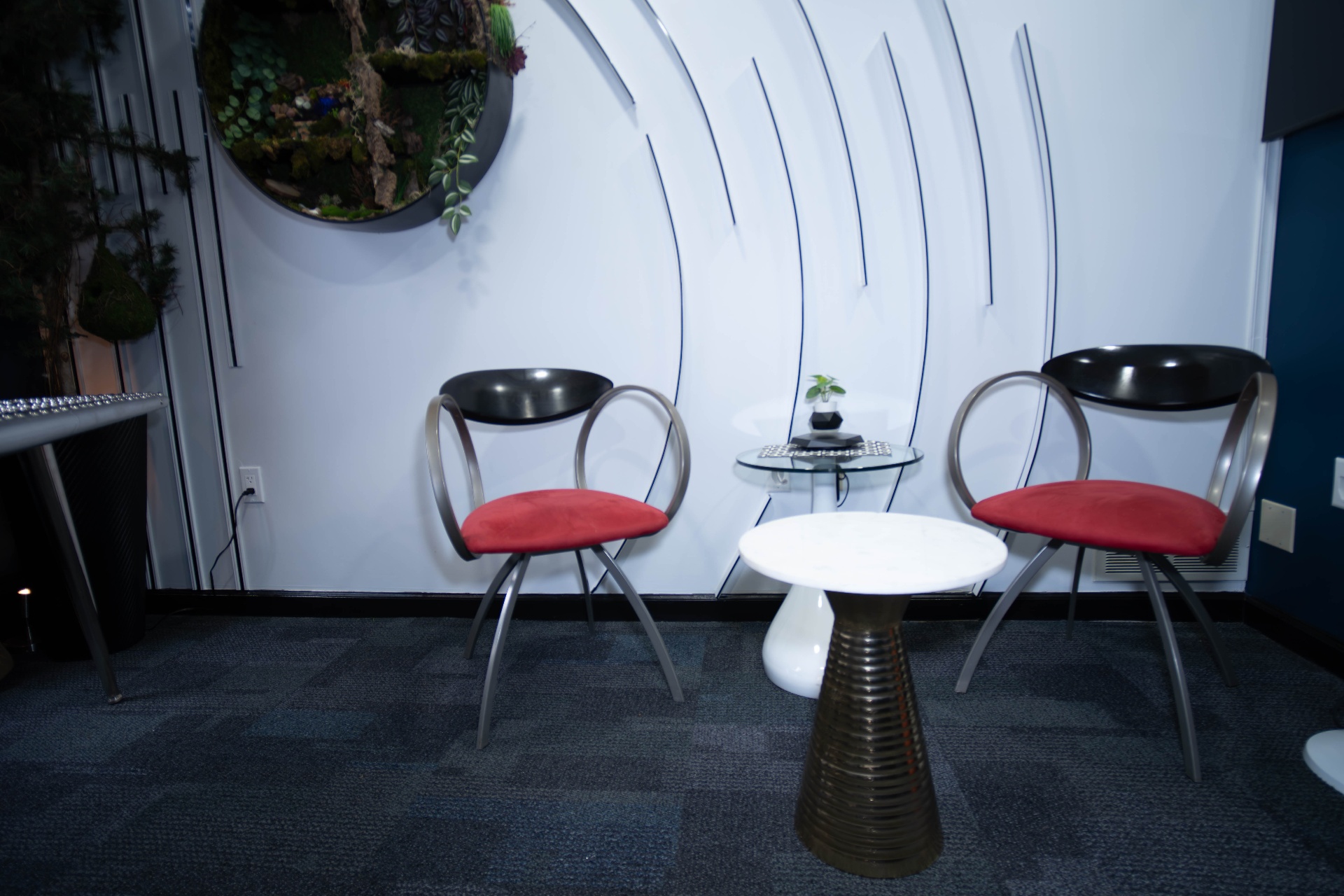 Symmetrical view of the lounge with paired red chairs