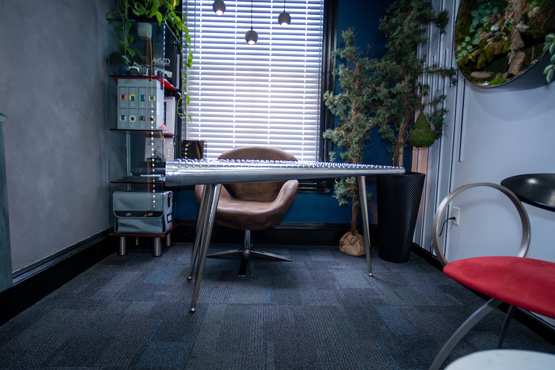 Private workspace with aviator riveted desk and leather swivel chair