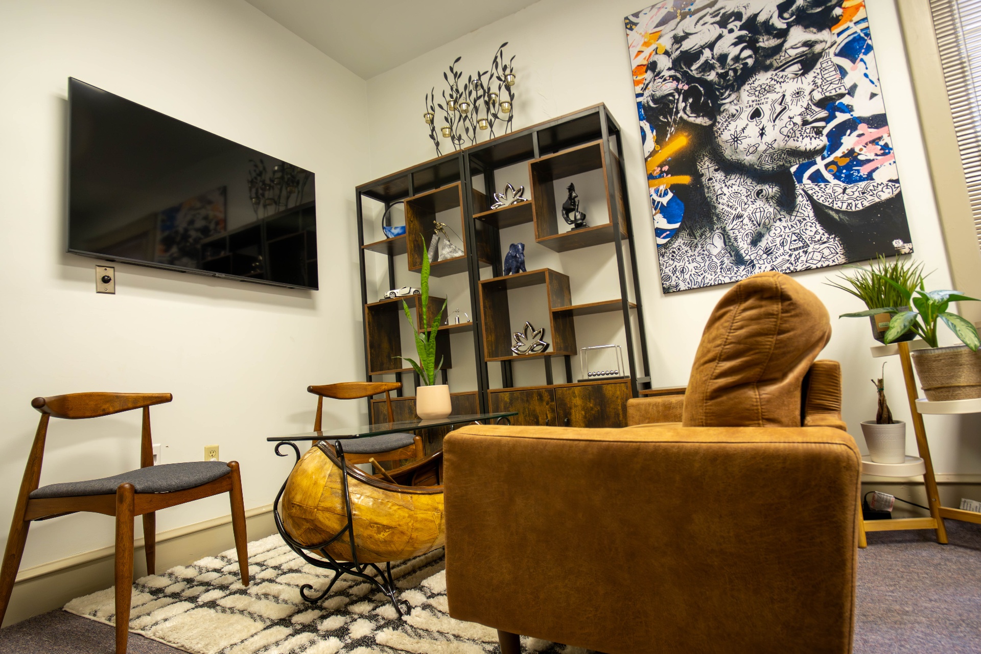 Low angle of the lounge highlighting the canoe table and bookcase styling