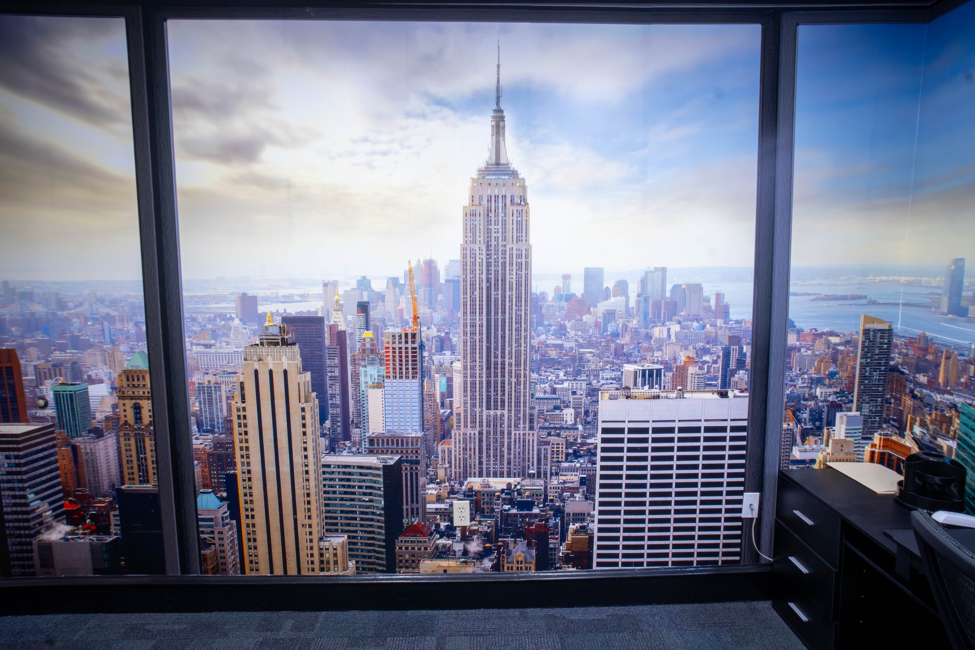 Trompe-l'oeil window mural with Manhattan skyline view