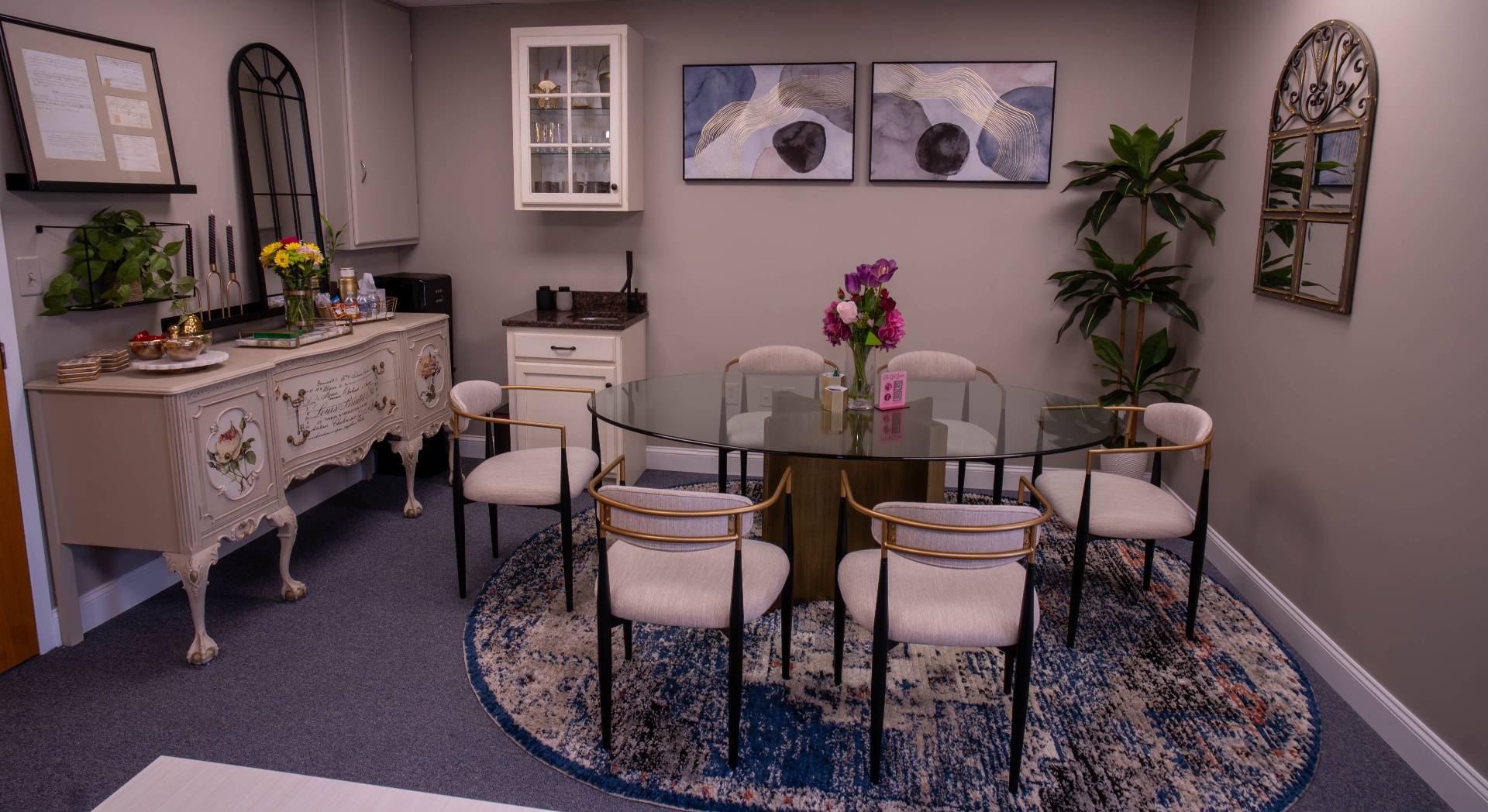 Conference and refreshment room with antique sideboard and glass round table
